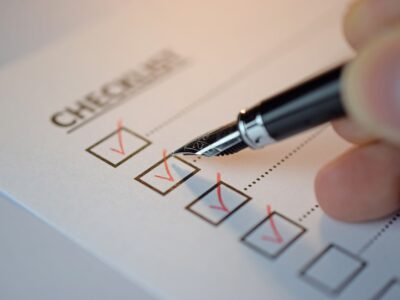 Image of a person checking off boxes on a checklist