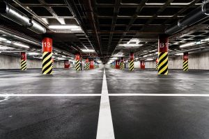 Parking garage underground interior neon lights in dark industrial building modern public construction